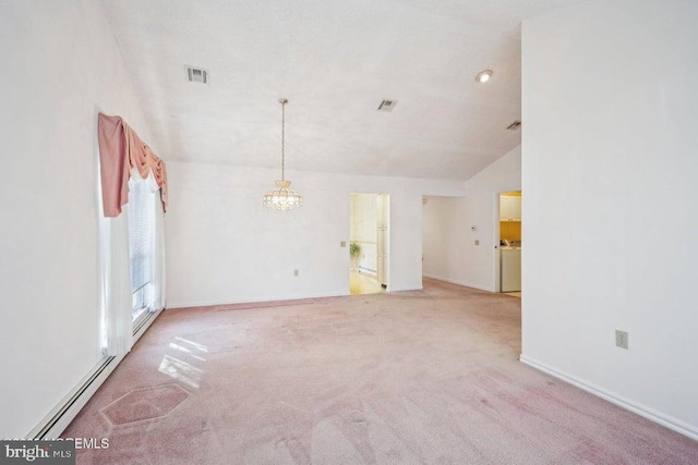 spare room with vaulted ceiling, carpet floors, baseboards, visible vents, and an inviting chandelier