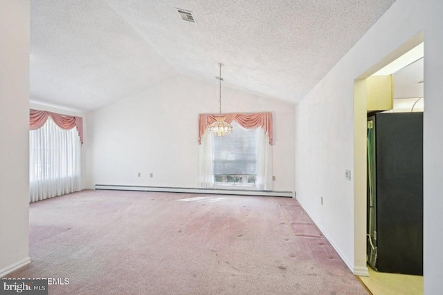 unfurnished room featuring a baseboard radiator, lofted ceiling, carpet floors, and an inviting chandelier