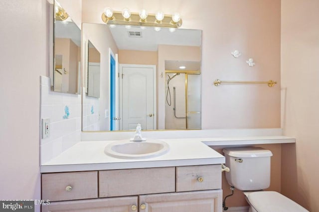 full bathroom featuring visible vents, toilet, vanity, a stall shower, and backsplash