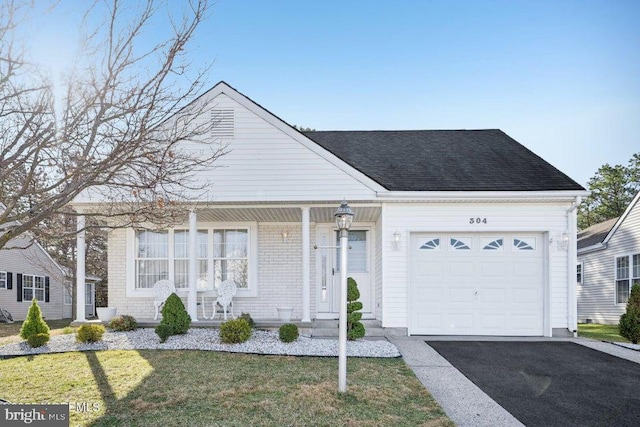 view of front of home with aphalt driveway, a garage, a front lawn, a shingled roof, and a porch