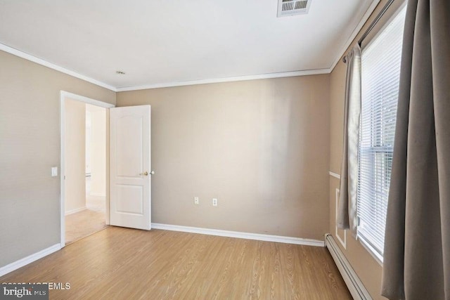 unfurnished room featuring visible vents, a healthy amount of sunlight, and light wood-type flooring