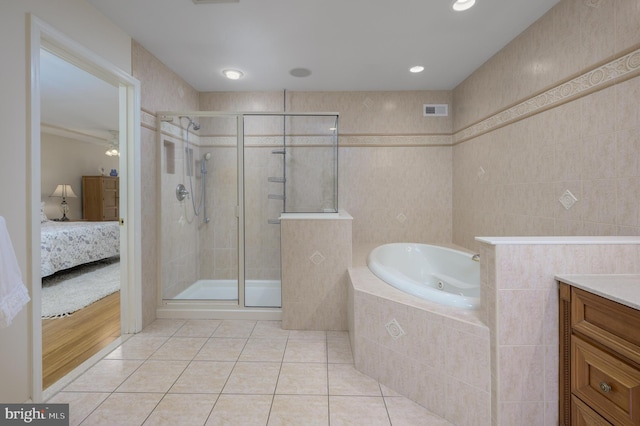 ensuite bathroom featuring ensuite bathroom, tile patterned floors, visible vents, and a stall shower