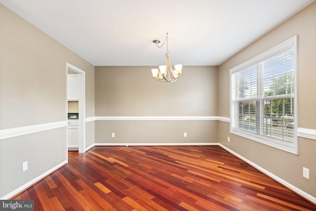 10 Sassafras Ln, Stafford, VA 22554 - empty room with wood finished floors, a chandelier, and baseboards