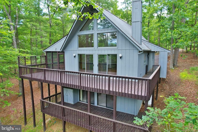 277 Anderson Rd, Basye, VA 22810 - back of property with a wooden deck and a chimney