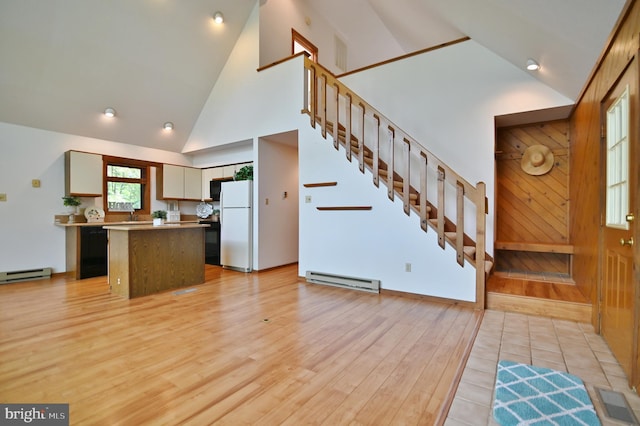 277 Anderson Rd, Basye, VA 22810 - kitchen featuring freestanding refrigerator, a baseboard radiator, high vaulted ceiling, a center island, and dishwasher