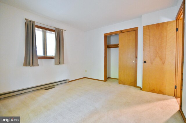 277 Anderson Rd, Basye, VA 22810 - unfurnished bedroom featuring light colored carpet, baseboard heating, and baseboards