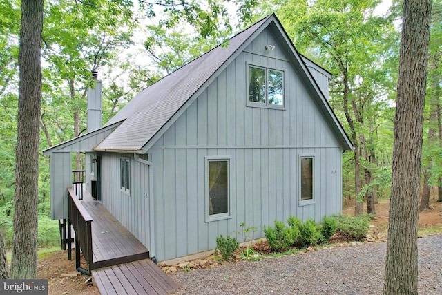 277 Anderson Rd, Basye, VA 22810 - view of property exterior featuring roof with shingles, board and batten siding, and a chimney