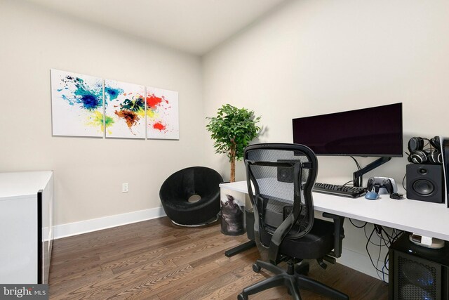 office area featuring baseboards and wood finished floors