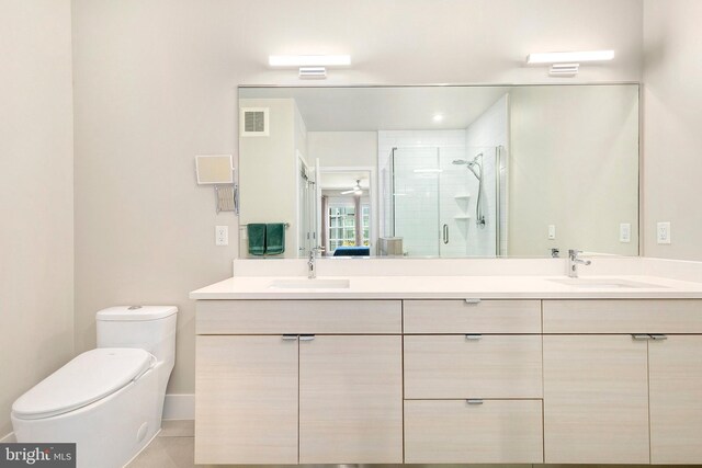 bathroom featuring visible vents, a sink, a stall shower, and toilet