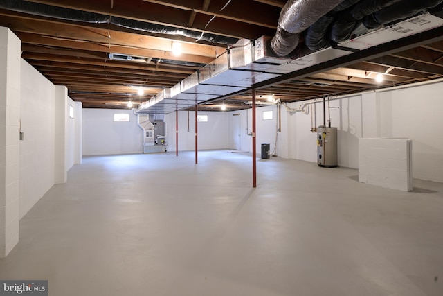 basement with water heater and heating unit