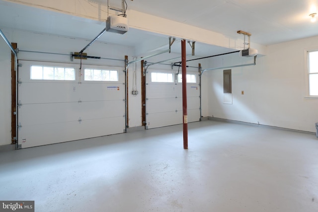 garage with electric panel and a garage door opener