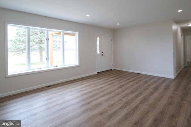entrance foyer featuring recessed lighting, baseboards, and visible vents