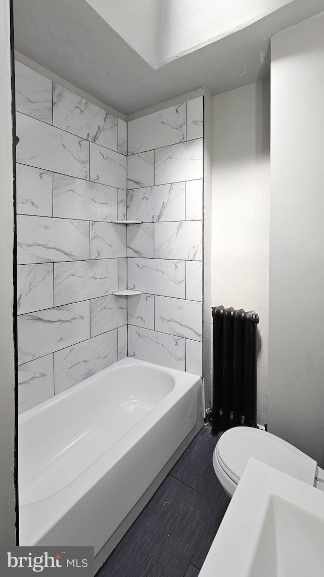 2105 S Woodstock St, Philadelphia, PA 19145 - bathroom featuring radiator heating unit and toilet
