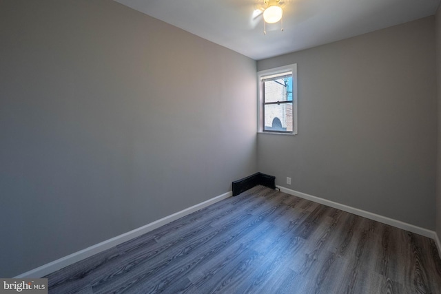 2105 S Woodstock St, Philadelphia, PA 19145 - empty room featuring ceiling fan, baseboards, and dark wood finished floors