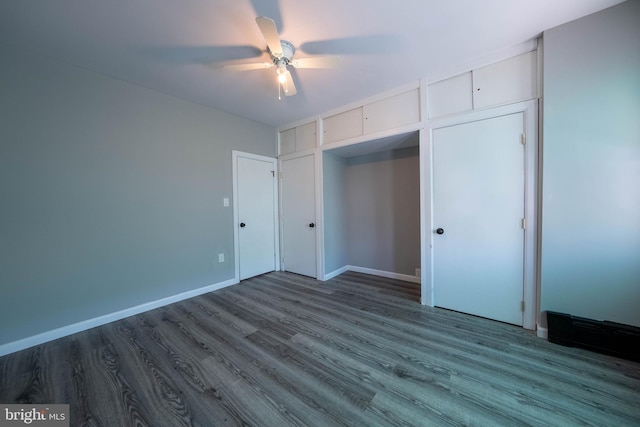 2105 S Woodstock St, Philadelphia, PA 19145 - unfurnished bedroom with baseboards, a ceiling fan, and wood finished floors