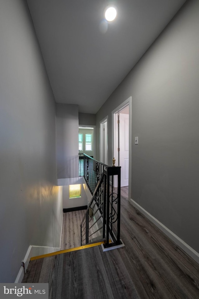 2105 S Woodstock St, Philadelphia, PA 19145 - hallway featuring an upstairs landing, baseboards, and wood finished floors