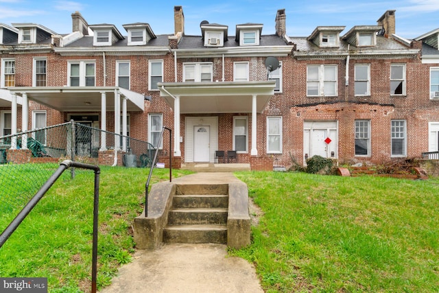 2609 Keyworth Ave, Baltimore, MD 21215 - view of property with fence, a front lawn, and brick siding