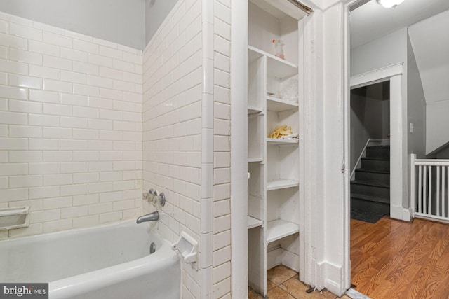 2609 Keyworth Ave, Baltimore, MD 21215 - bathroom with wood finished floors and bathtub / shower combination