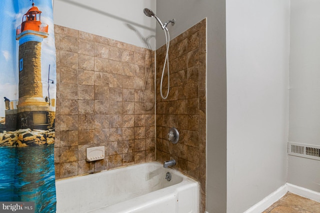 2609 Keyworth Ave, Baltimore, MD 21215 - full bathroom featuring bathing tub / shower combination, a wood stove, baseboards, and visible vents