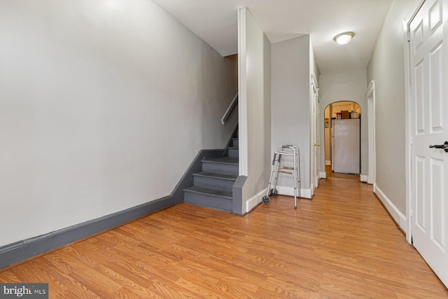 2609 Keyworth Ave, Baltimore, MD 21215 - stairway featuring arched walkways, wood finished floors, and baseboards