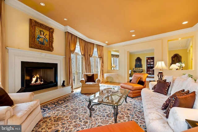 living room featuring ornamental molding, recessed lighting, and a warm lit fireplace