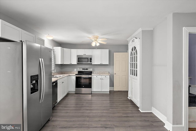 kitchen featuring white cabinetry, a ceiling fan, appliances with stainless steel finishes, and light countertops