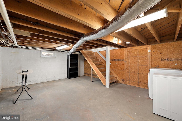 below grade area with stairs and washer / clothes dryer