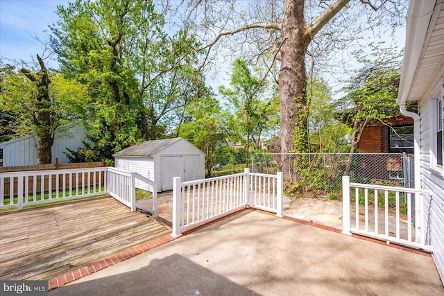 view of patio with an outdoor structure, a shed, and fence
