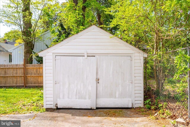 view of shed with fence