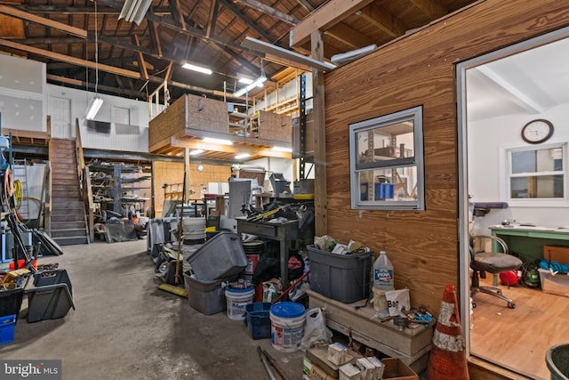 interior space with high vaulted ceiling and concrete floors