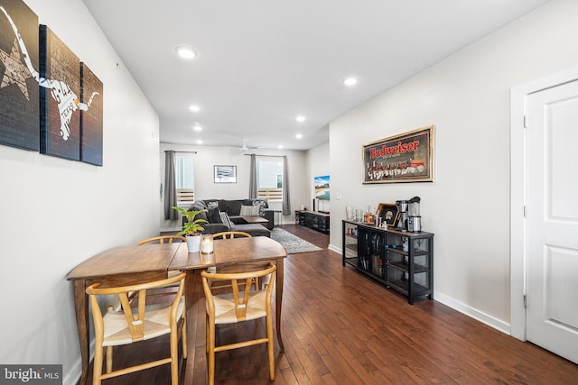dining room with hardwood / wood-style floors, recessed lighting, and baseboards