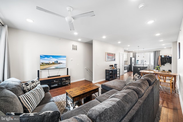 living room featuring recessed lighting, visible vents, wood-type flooring, and ceiling fan