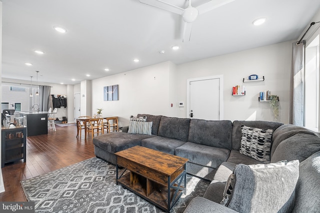 living area with recessed lighting, dark wood finished floors, and ceiling fan