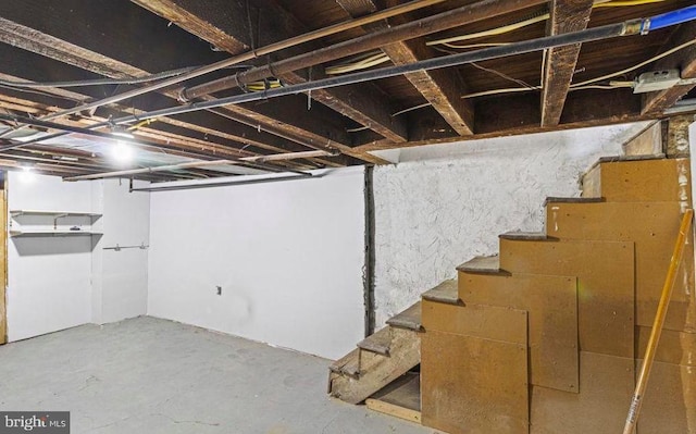 unfinished basement with stairs