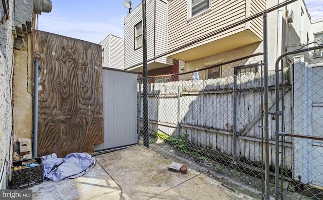 view of gate featuring fence