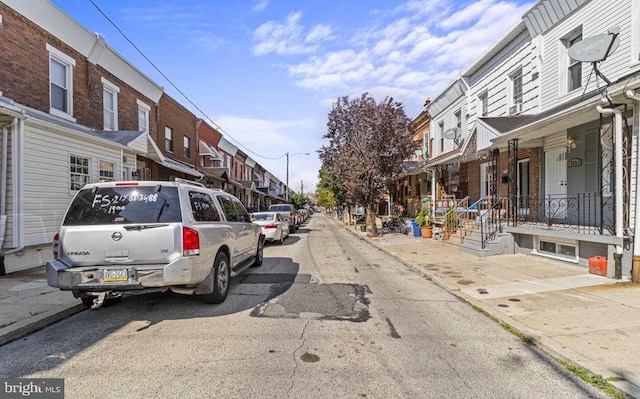 view of street with a residential view and sidewalks