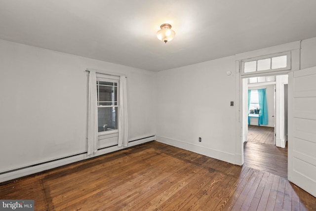 911 Martinsburg Pike, Winchester, VA 22601 - spare room featuring dark wood-type flooring, a baseboard radiator, and baseboards