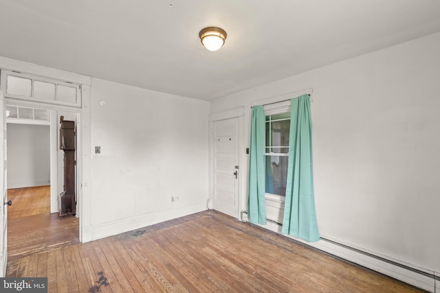 911 Martinsburg Pike, Winchester, VA 22601 - spare room with hardwood / wood-style flooring, a baseboard heating unit, and baseboards
