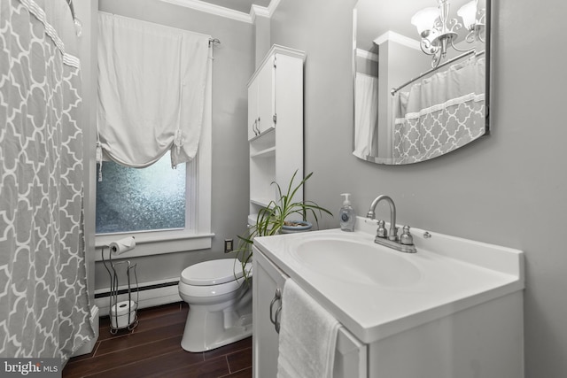911 Martinsburg Pike, Winchester, VA 22601 - bathroom featuring ornamental molding, a chandelier, vanity, wood finished floors, and a baseboard radiator