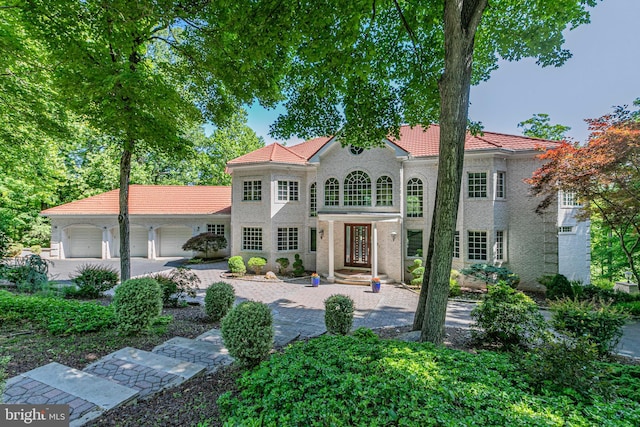 429 Wendover Dr, Princeton, NJ 08540 - mediterranean / spanish house featuring a garage, a tile roof, driveway, and stucco siding