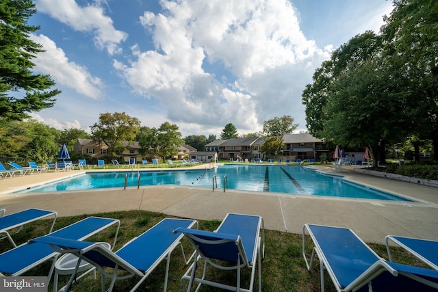 community pool featuring a patio area