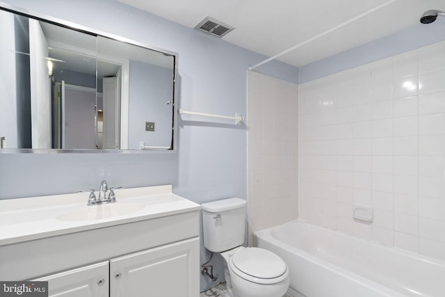 bathroom featuring toilet, vanity, and tub / shower combination