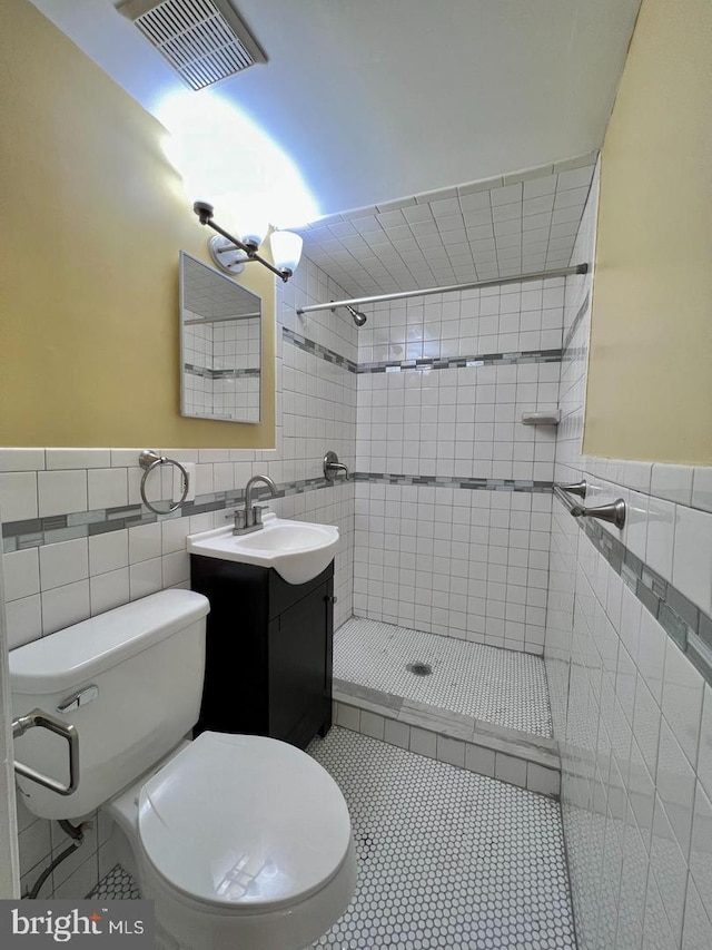 2904 11th St NW, Washington, DC 20001 - full bath with a tile shower, toilet, tile patterned floors, and tile walls