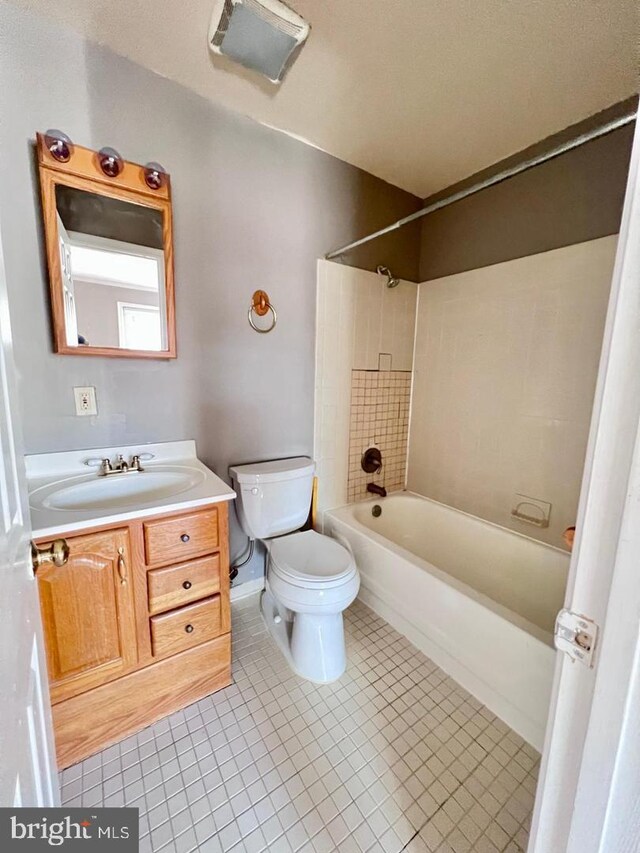 2904 11th St NW, Washington, DC 20001 - full bath with tile patterned flooring, washtub / shower combination, toilet, and vanity
