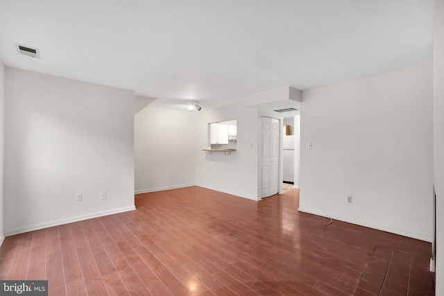 2904 11th St NW, Washington, DC 20001 - unfurnished living room featuring wood finished floors, visible vents, and baseboards