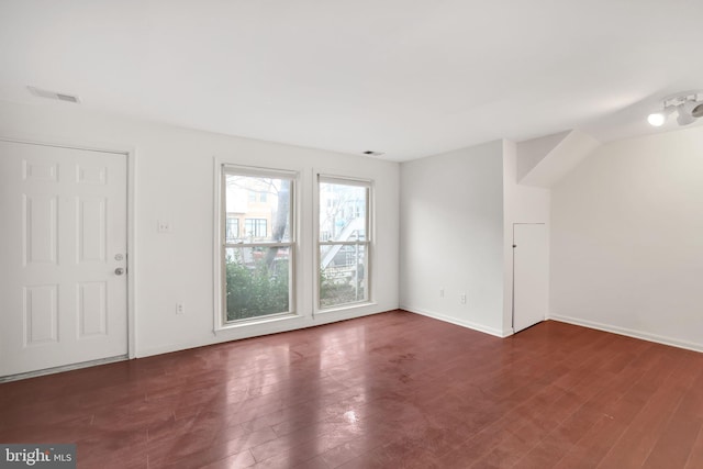 2904 11th St NW, Washington, DC 20001 - unfurnished living room with visible vents, baseboards, and wood finished floors