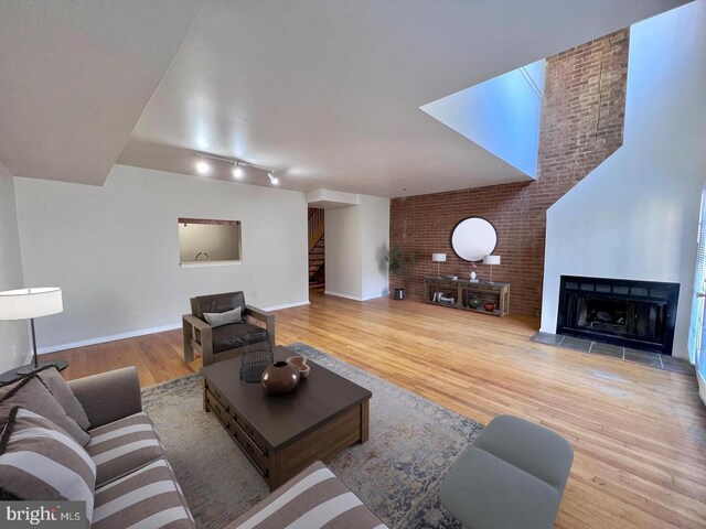 2904 11th St NW, Washington, DC 20001 - living area featuring stairway, a fireplace, baseboards, and wood finished floors