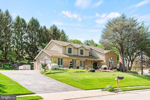 3672 Cimmeron Rd, York, PA 17402 - traditional home featuring driveway, brick siding, an attached garage, and a front yard