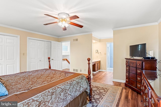 3672 Cimmeron Rd, York, PA 17402 - bedroom with two closets, wood finished floors, and ornamental molding