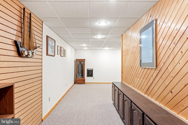 3672 Cimmeron Rd, York, PA 17402 - corridor featuring light colored carpet, wood walls, baseboards, and a drop ceiling